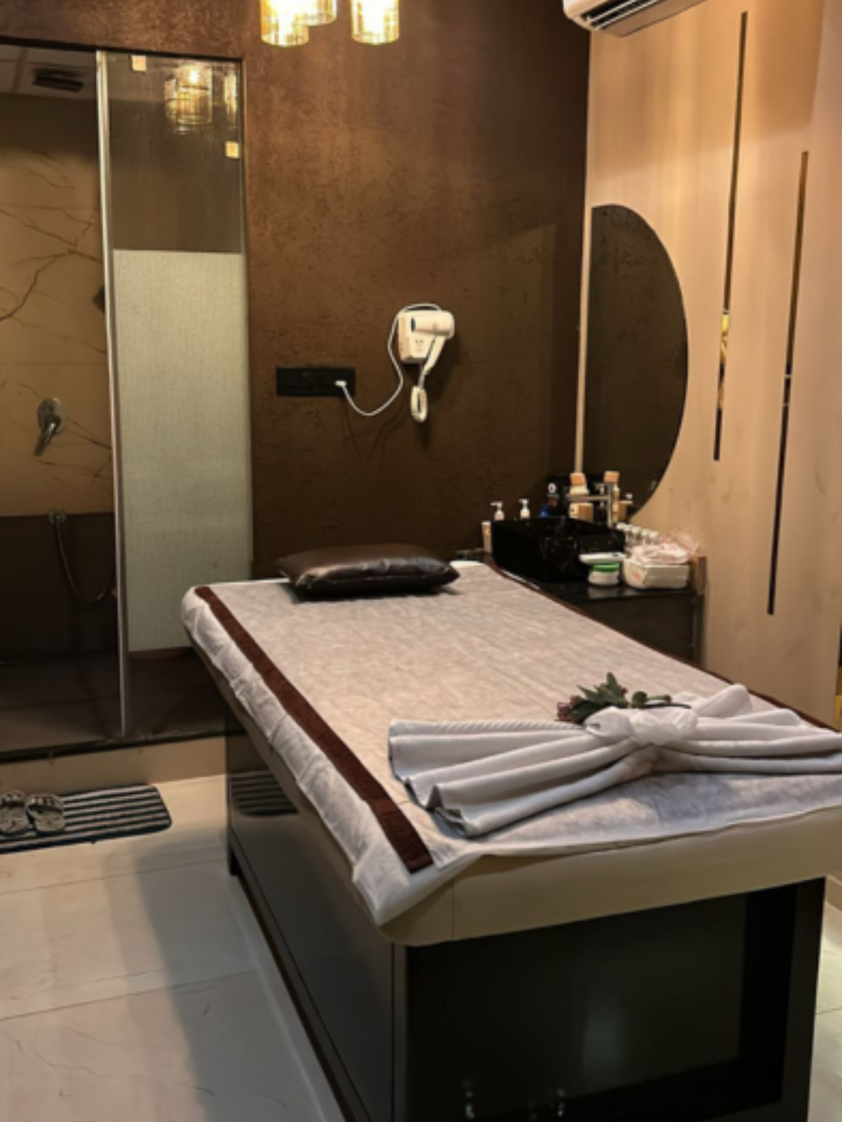 Modern spa room at Oceanic Spawith soft lighting and comfortable massage tables
