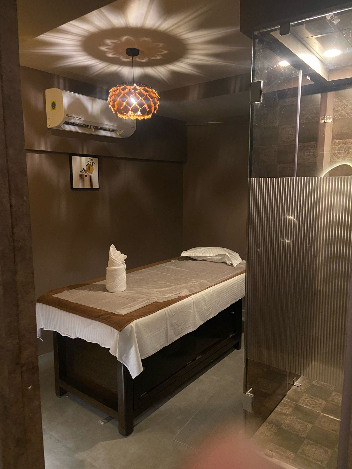 Modern spa room at Oceanic Spawith soft lighting and comfortable massage tables