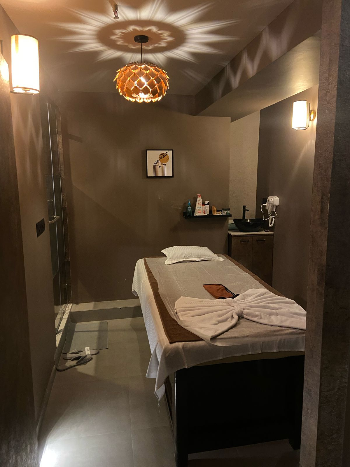 Modern spa room at Oceanic Spawith soft lighting and comfortable massage tables