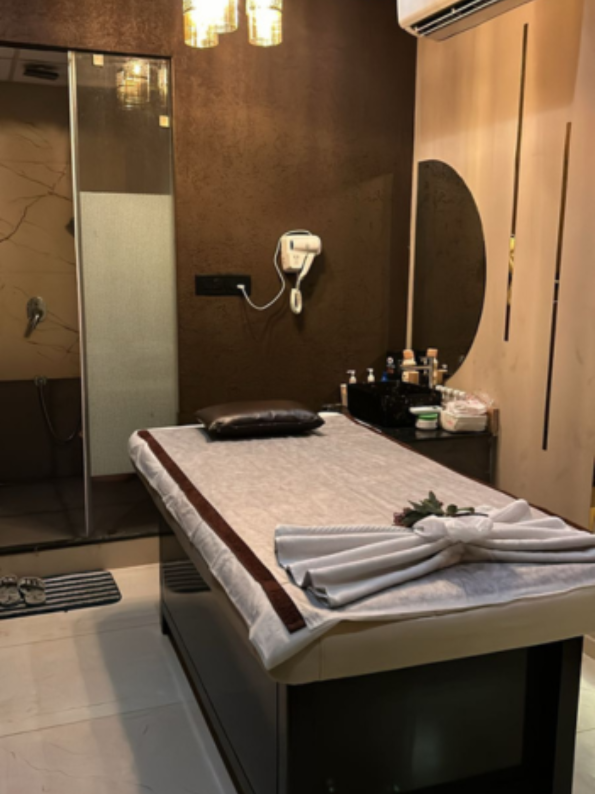 Modern spa room at Oceanic Spawith soft lighting and comfortable massage tables
